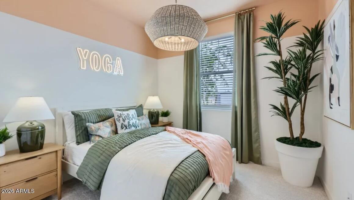15602 West Miami Street Goodyear, AZ 85338 - Photo 13 of 25 a bedroom with a bed and a potted plant