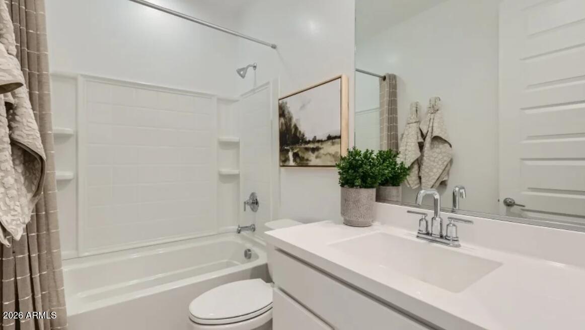 15602 West Miami Street Goodyear, AZ 85338 - Photo 17 of 25 a bathroom with a sink a toilet and shower