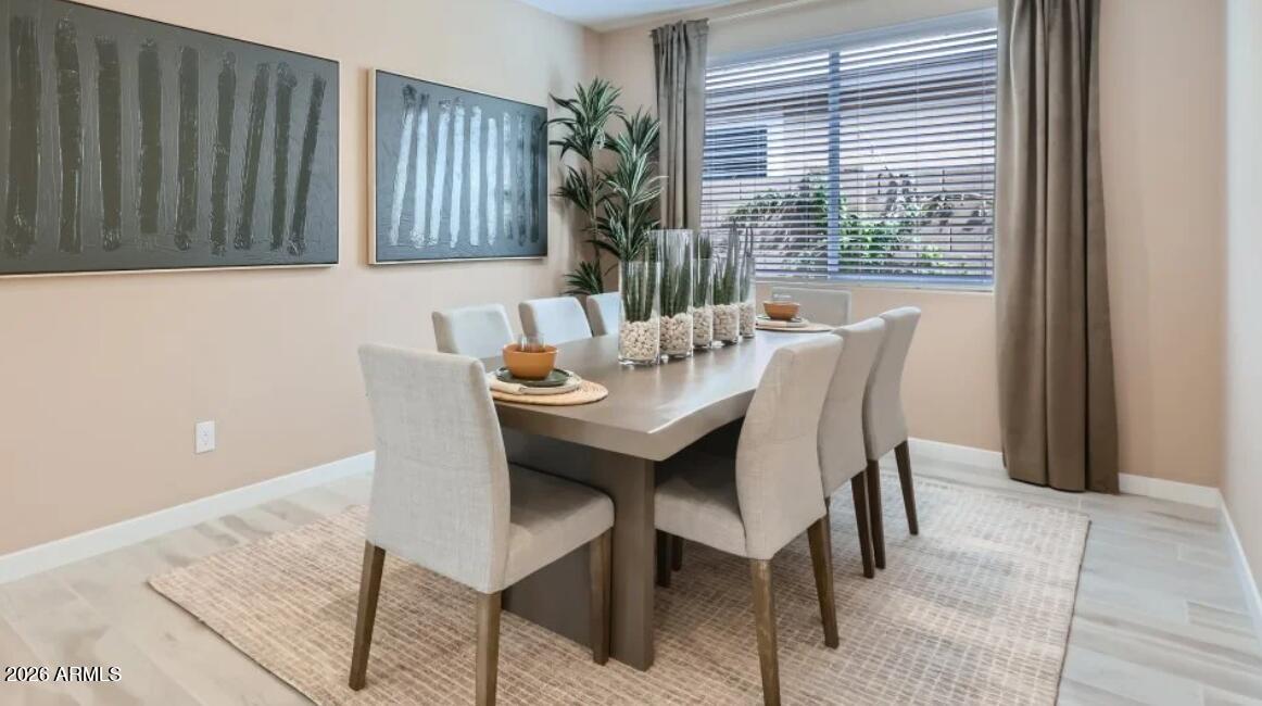15602 West Miami Street Goodyear, AZ 85338 - Photo 4 of 25 a view of a dining room with furniture and window