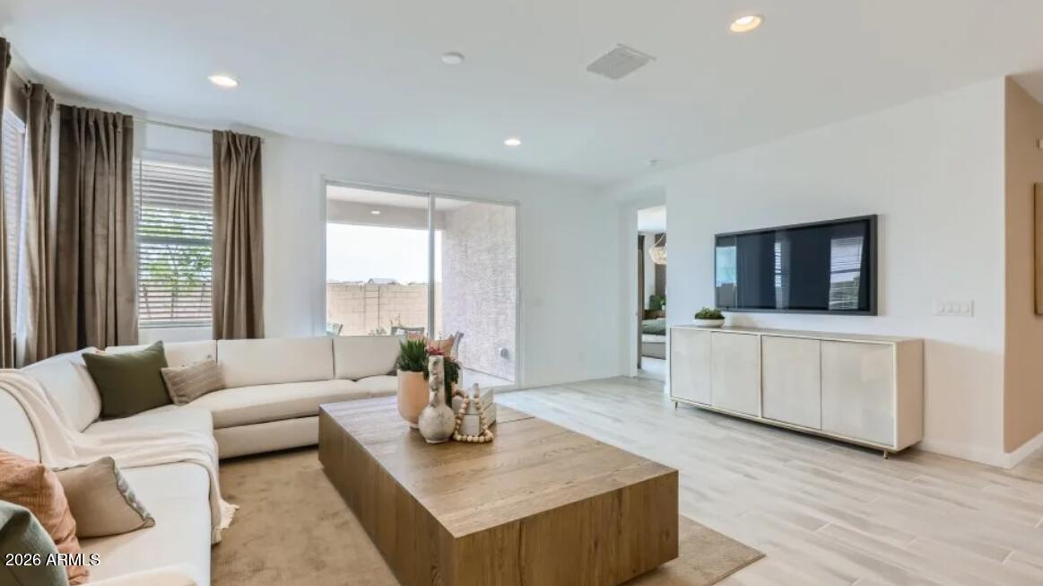15602 West Miami Street Goodyear, AZ 85338 - Photo 6 of 25 a living room with furniture and a flat screen tv