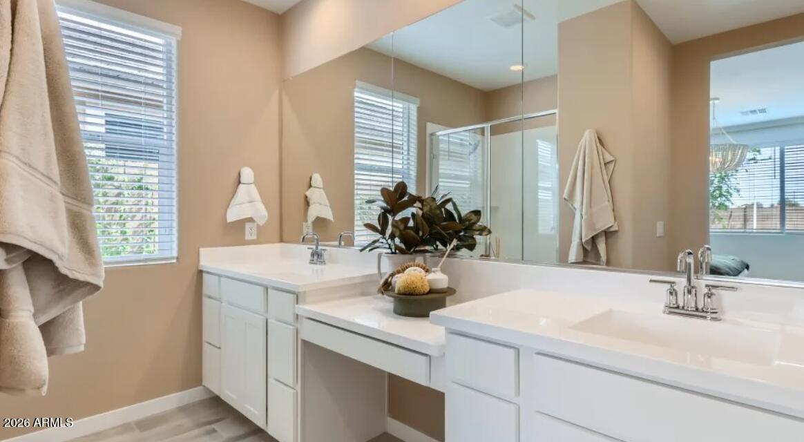 15602 West Miami Street Goodyear, AZ 85338 - Photo 9 of 25 a bathroom with a sink double vanity and a mirror