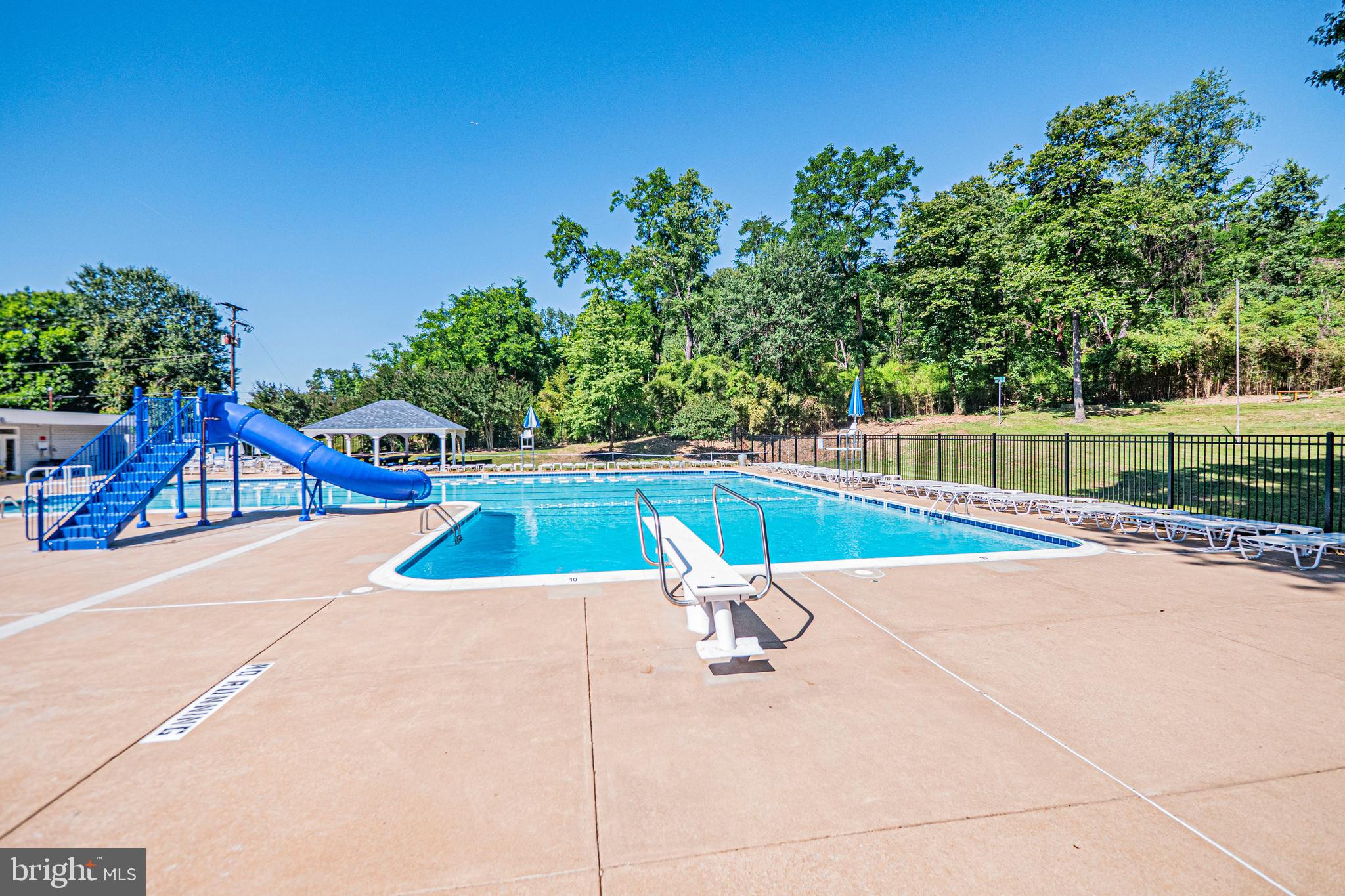 5448 Edsall Ridge Place Alexandria, VA 22312 - Photo 52 of 52 a view of a tennis ground with large trees