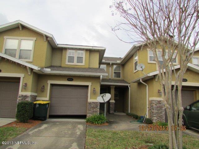 8855 Inlet Bluff Drive Jacksonville, FL 32216 - Photo 1 of 1 a view of a house with a yard and large tree
