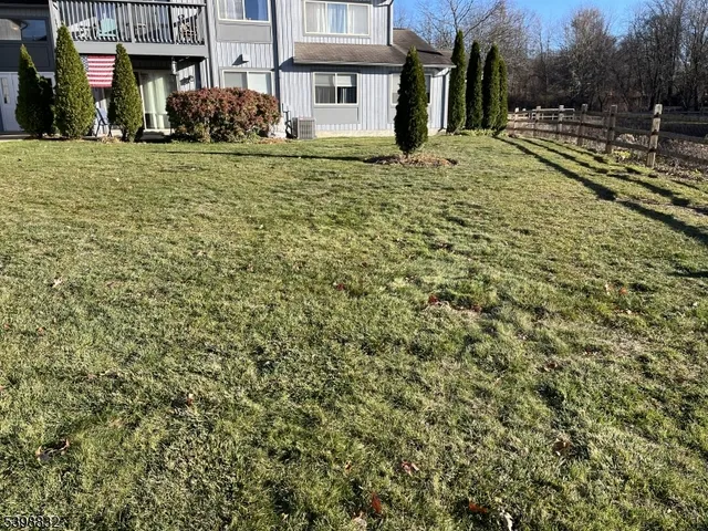 a view of a building with a yard