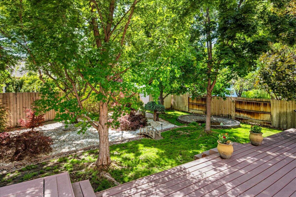 1339 Southwest Rimrock Way Redmond, OR 97756 - Photo 26 of 26 a view of a garden with plants and large trees