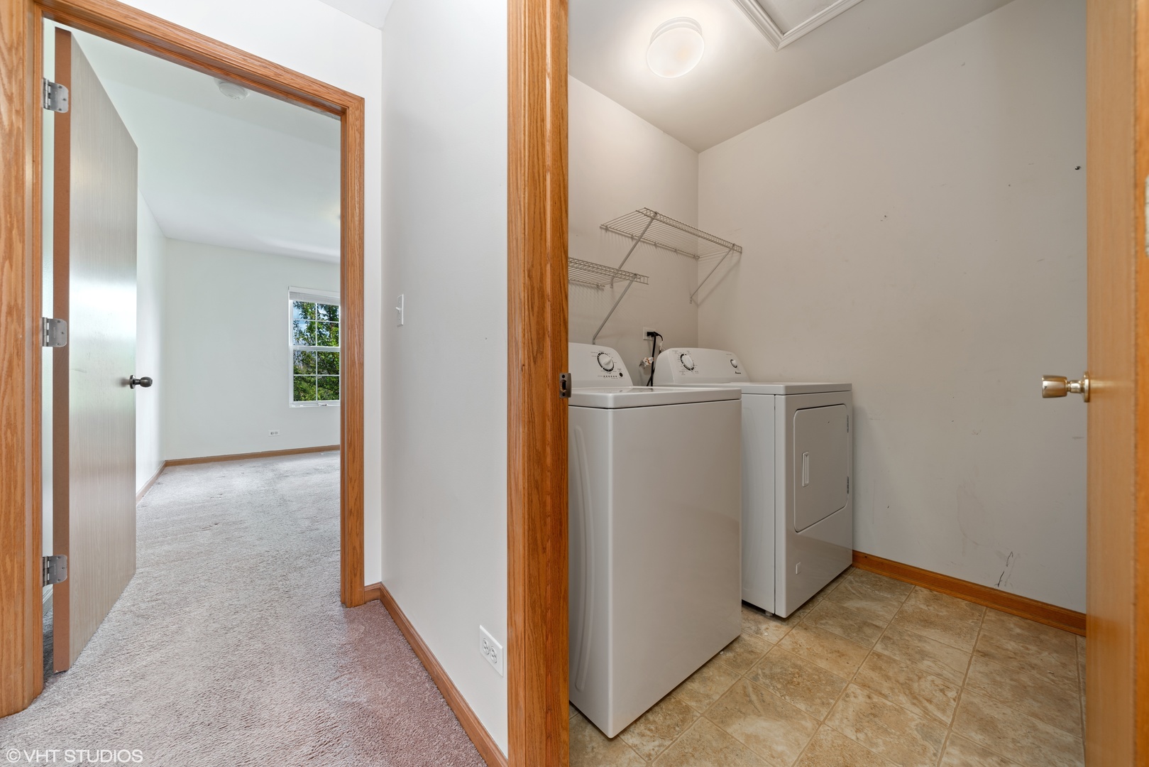 131 Springbrook Trail South Oswego, IL 60543 - Photo 13 of 16 a view of a hallway with wooden cabinets