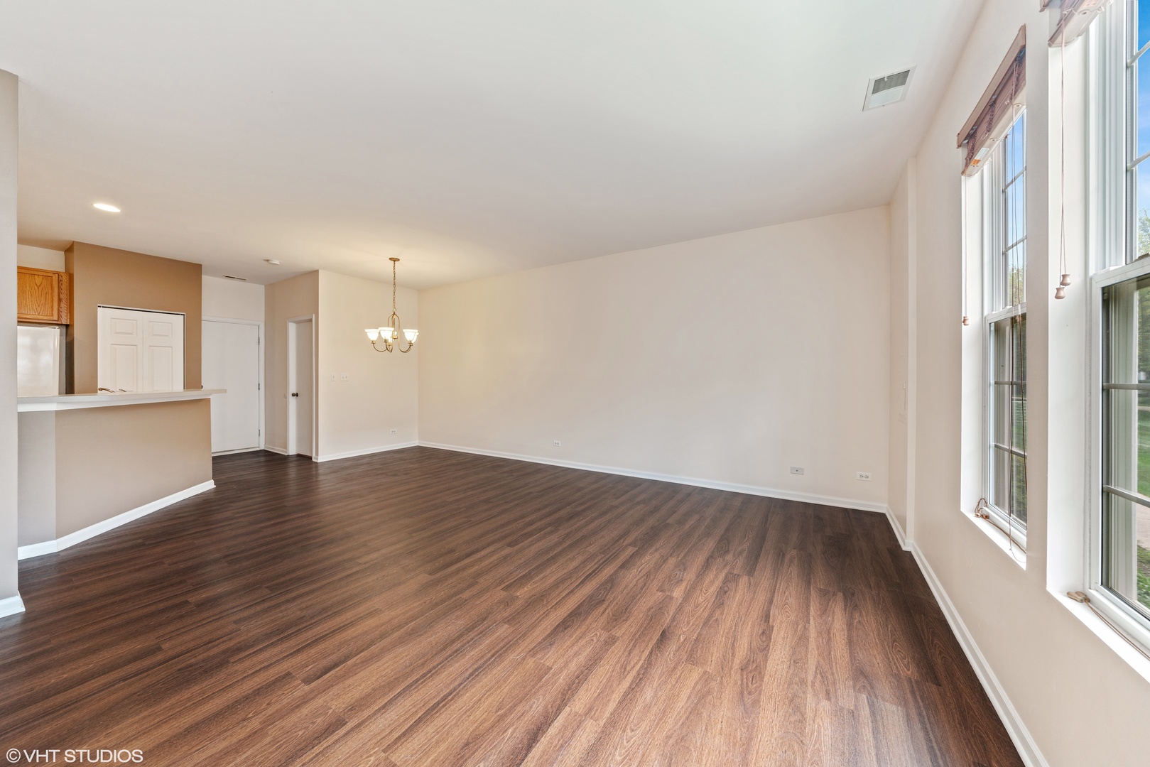 131 Springbrook Trail South Oswego, IL 60543 - Photo 3 of 16 wooden floor in an empty room with a window