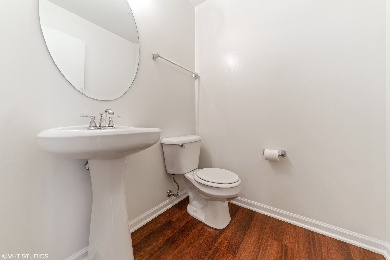 131 Springbrook Trail South Oswego, IL 60543 - Photo 7 of 16 a bathroom with a sink toilet and a mirror