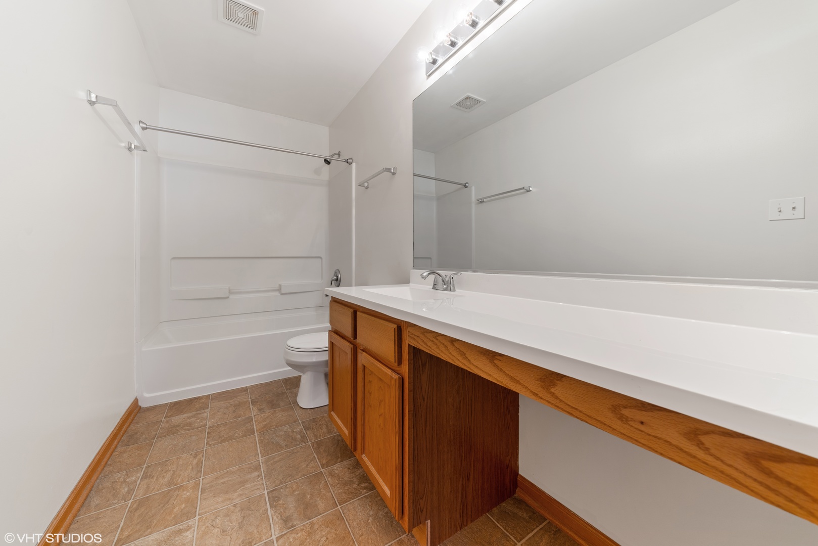 131 Springbrook Trail South Oswego, IL 60543 - Photo 10 of 16 a bathroom with a sink a toilet and shower