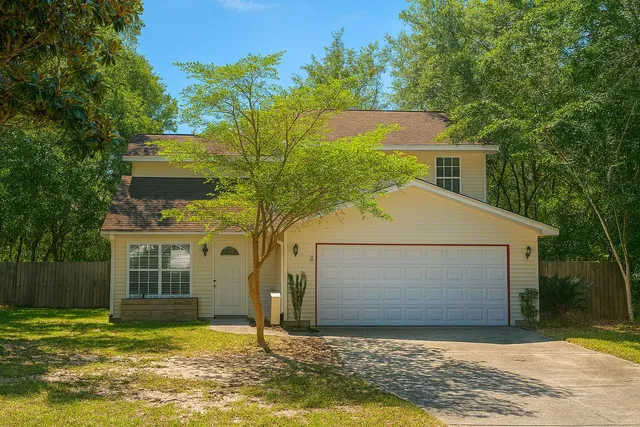 a view of a house with a small yard