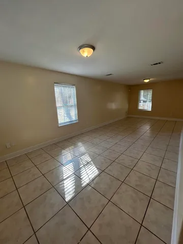 a view of an empty room and window