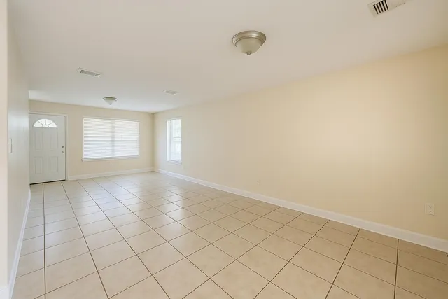 a view of an empty room and window