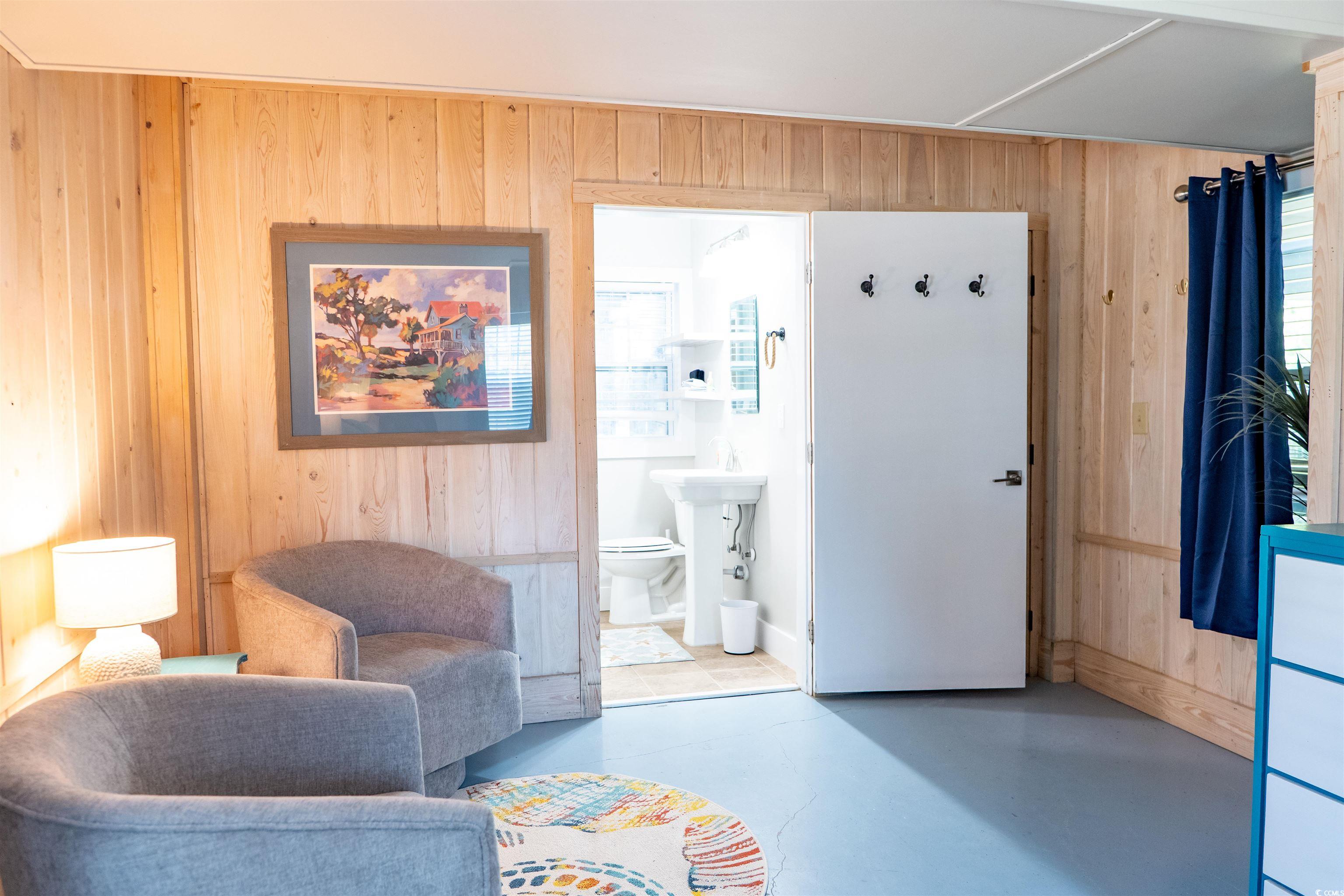 415 Sundial Drive Pawleys Island, SC 29585 - Photo 21 of 35 Bedroom with ornamental molding, multiple windows, and wood finished floors