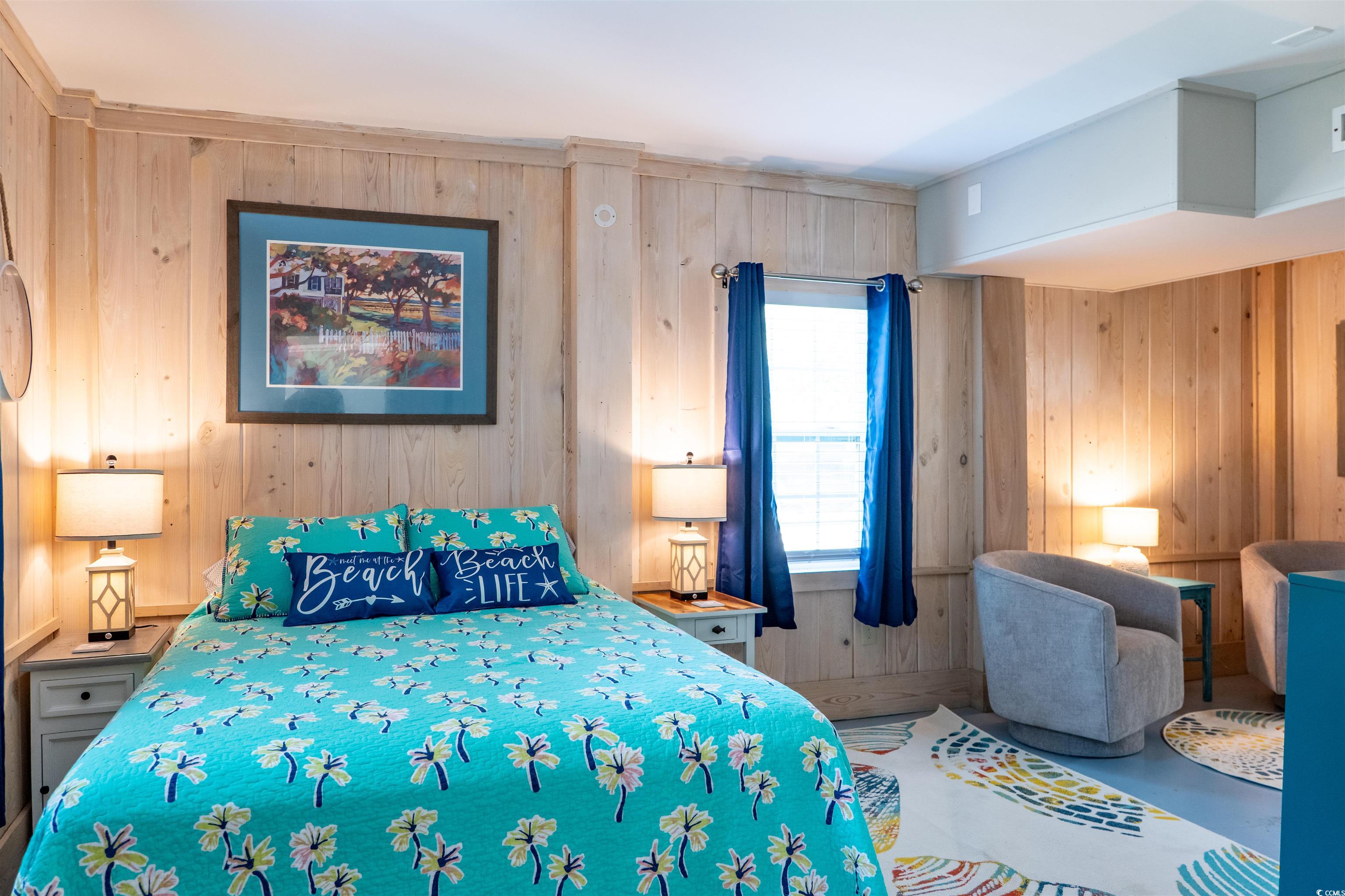 415 Sundial Drive Pawleys Island, SC 29585 - Photo 22 of 35 Sitting room featuring wooden walls and concrete flooring