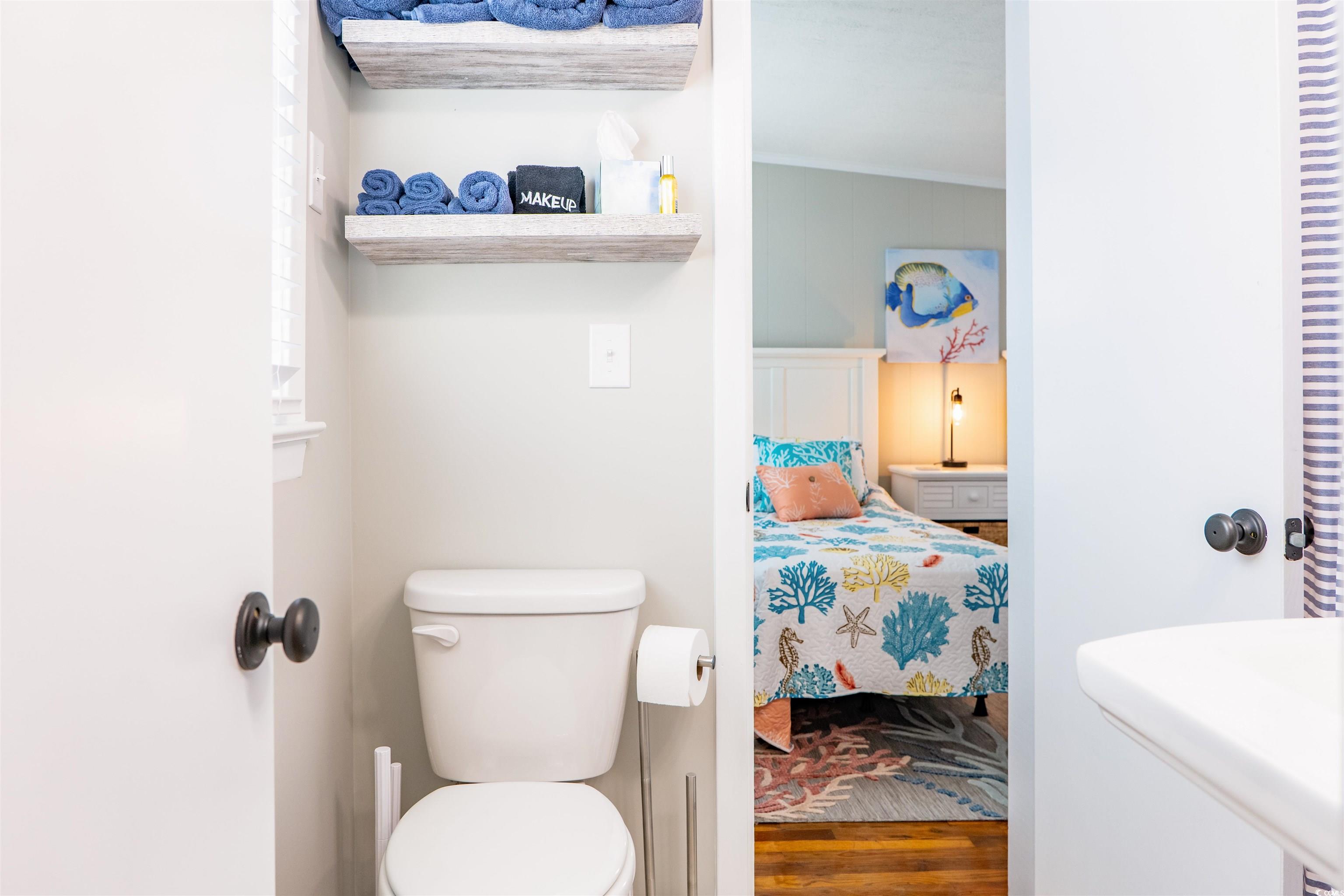 415 Sundial Drive Pawleys Island, SC 29585 - Photo 23 of 35 Bedroom featuring wooden walls