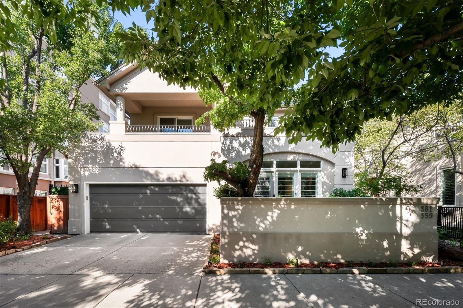 361 Detroit Street Denver, CO 80206 - Photo 16 of 46 a front view of a house with a garden