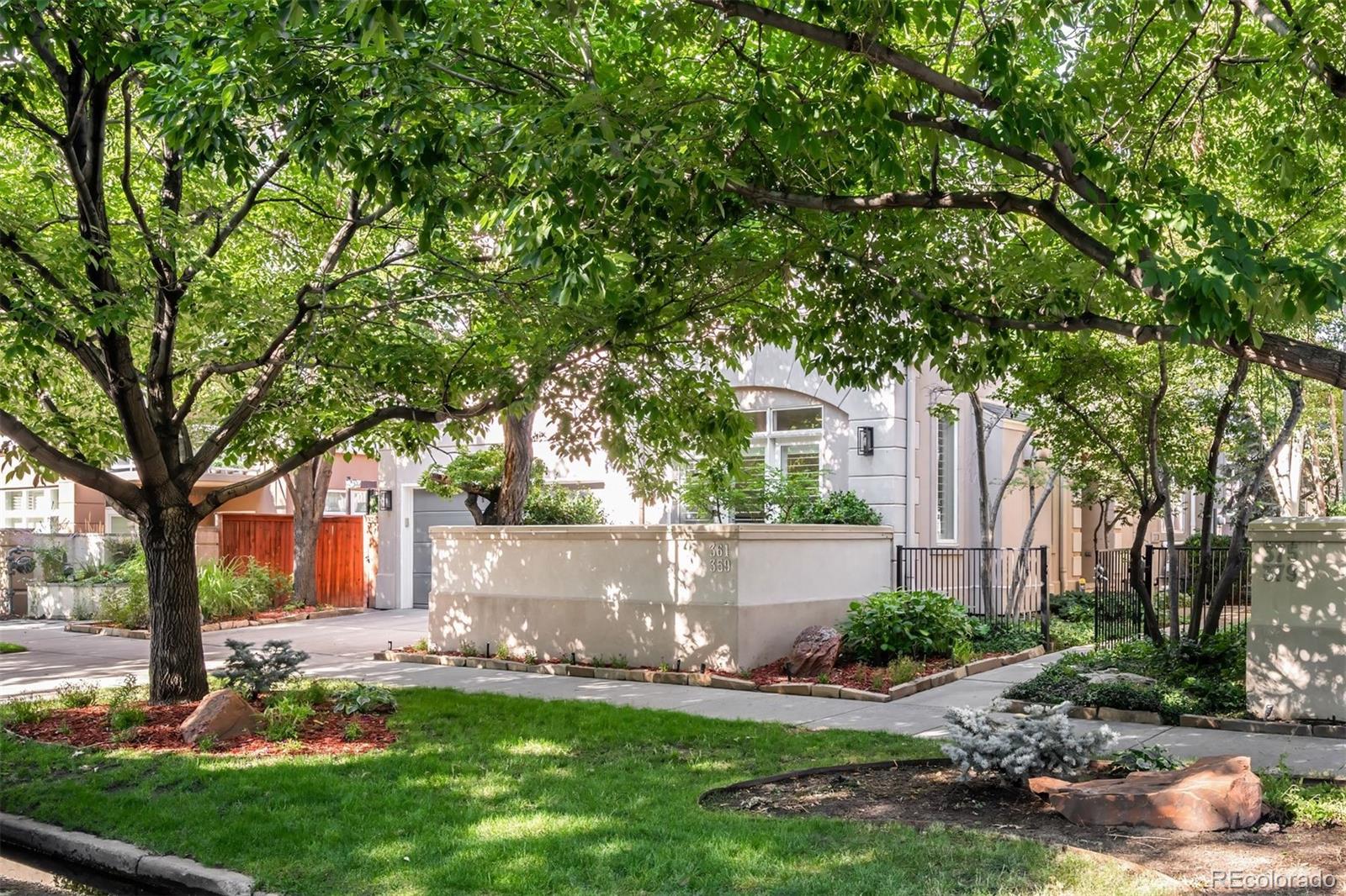 361 Detroit Street Denver, CO 80206 - Photo 18 of 46 front view of a house with a yard