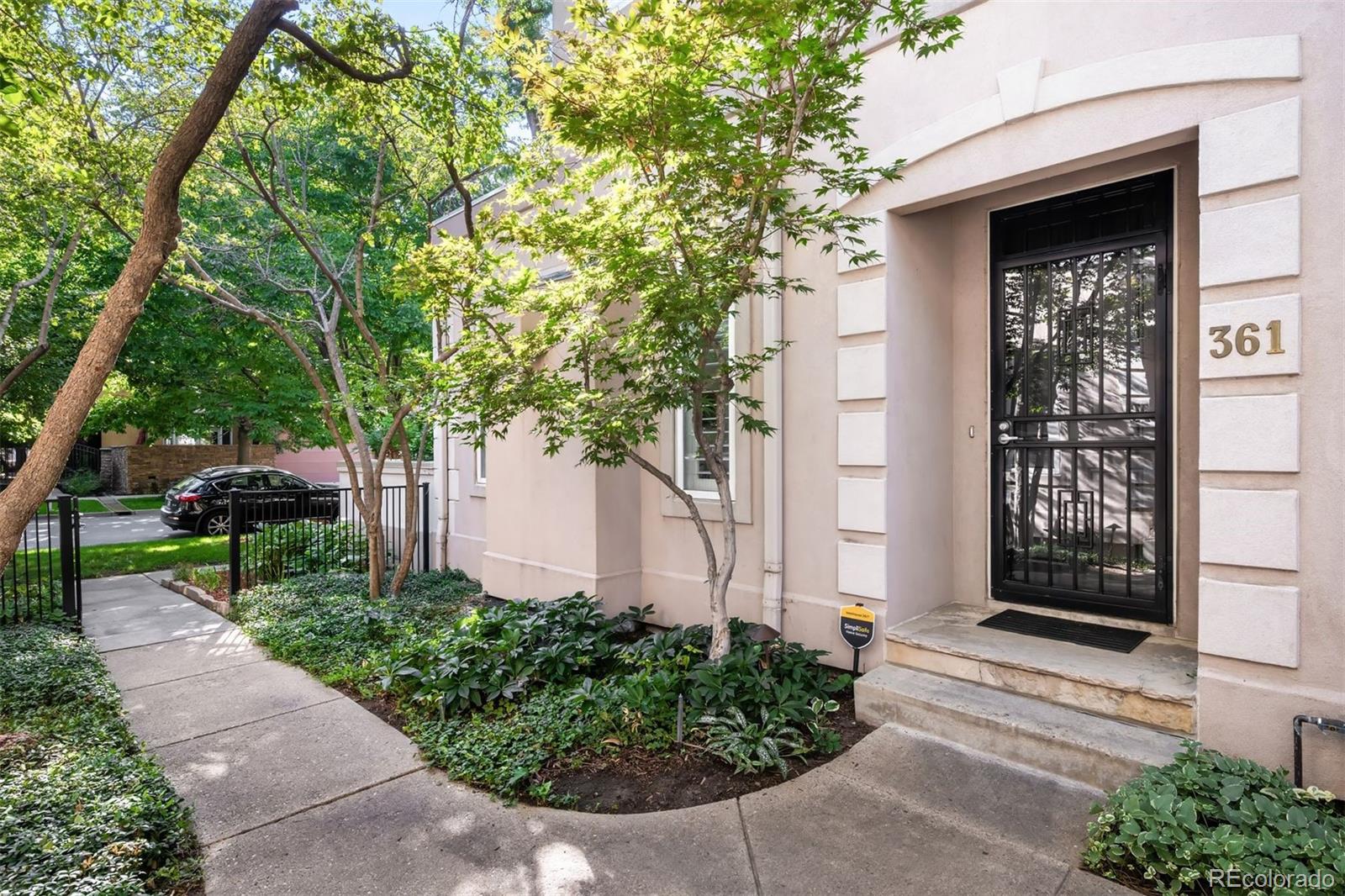 361 Detroit Street Denver, CO 80206 - Photo 20 of 46 a front view of a house with a yard