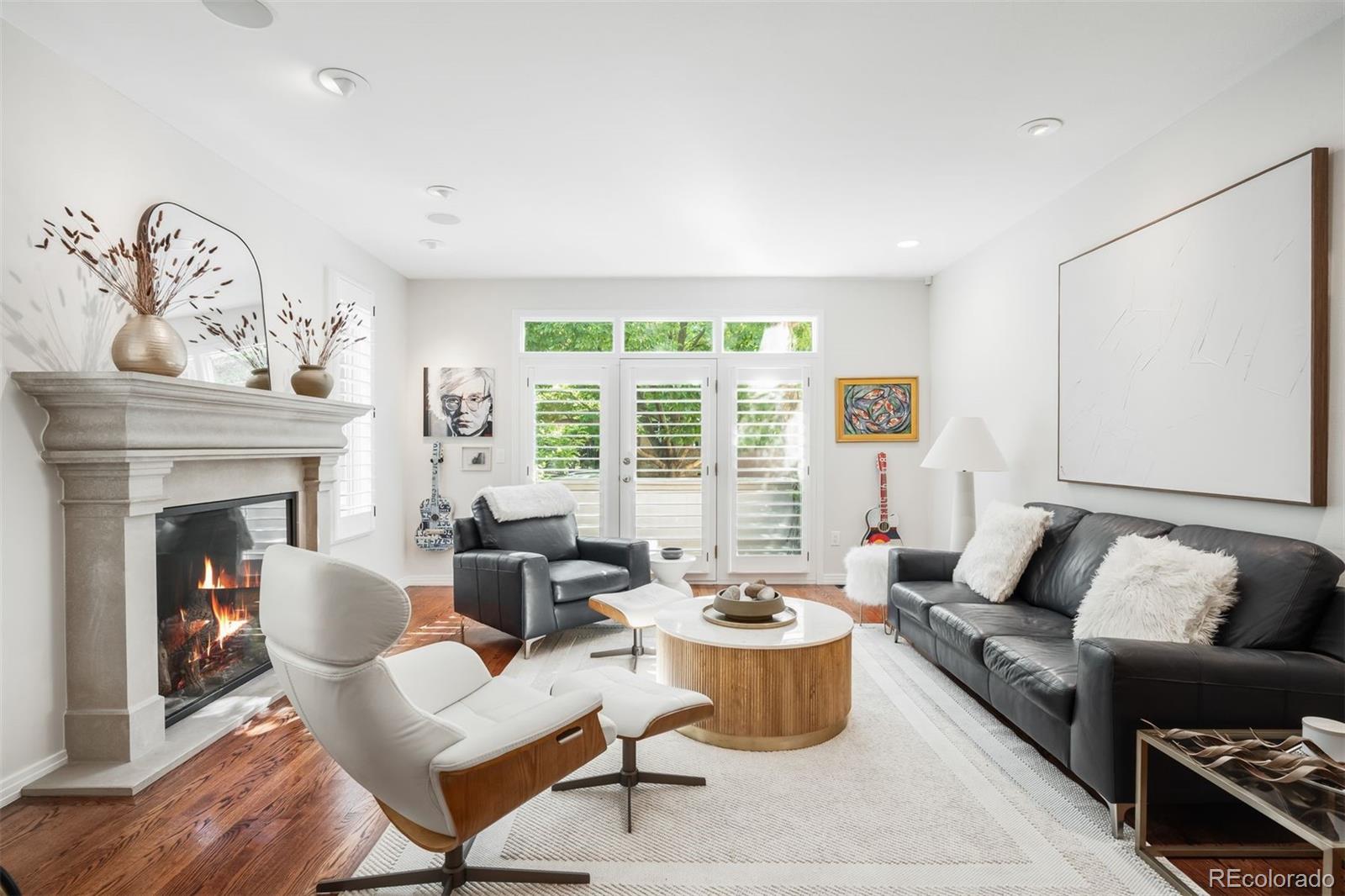361 Detroit Street Denver, CO 80206 - Photo 2 of 46 a living room with furniture and a fireplace