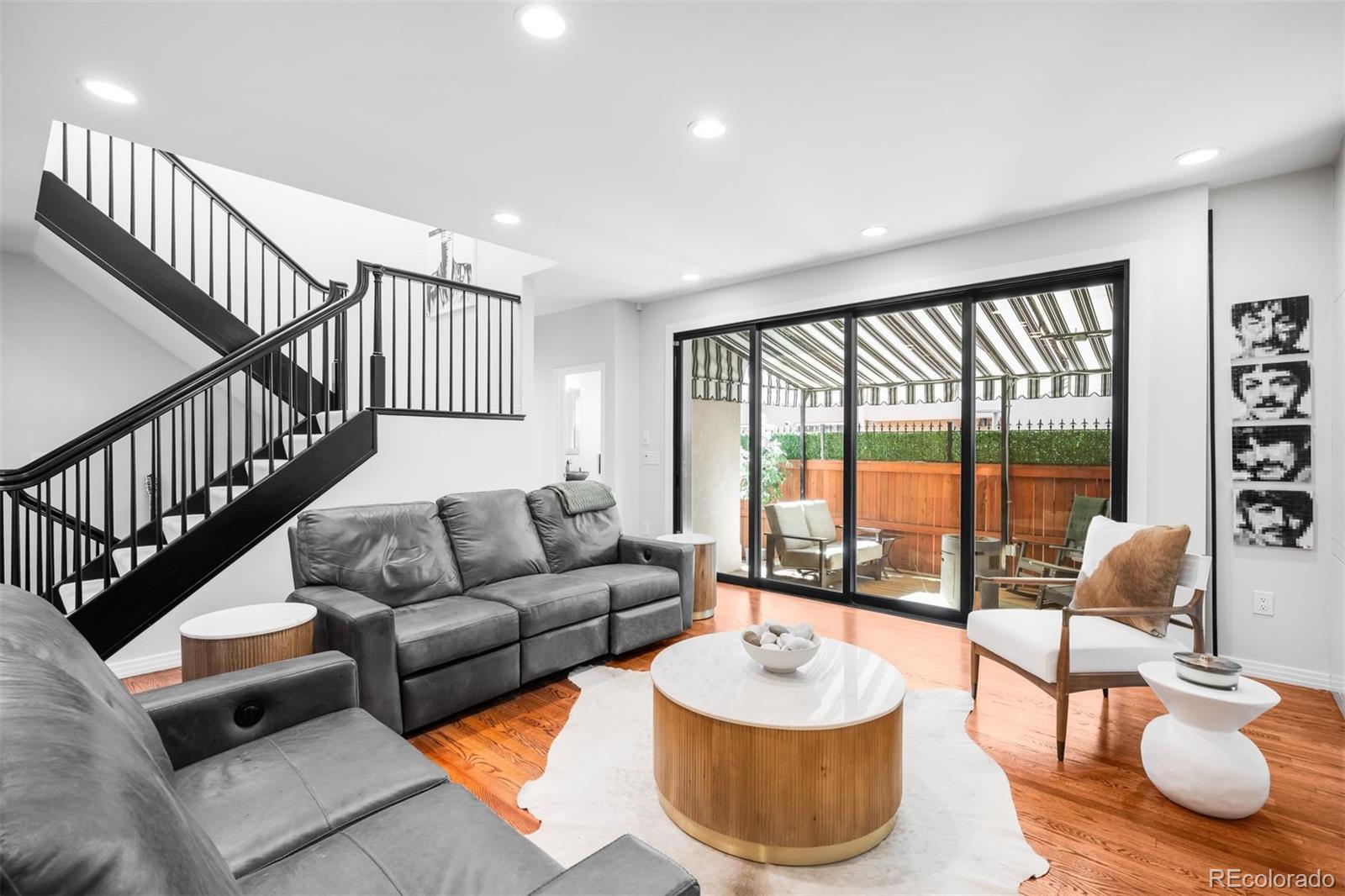 361 Detroit Street Denver, CO 80206 - Photo 22 of 46 a living room with furniture and a large window