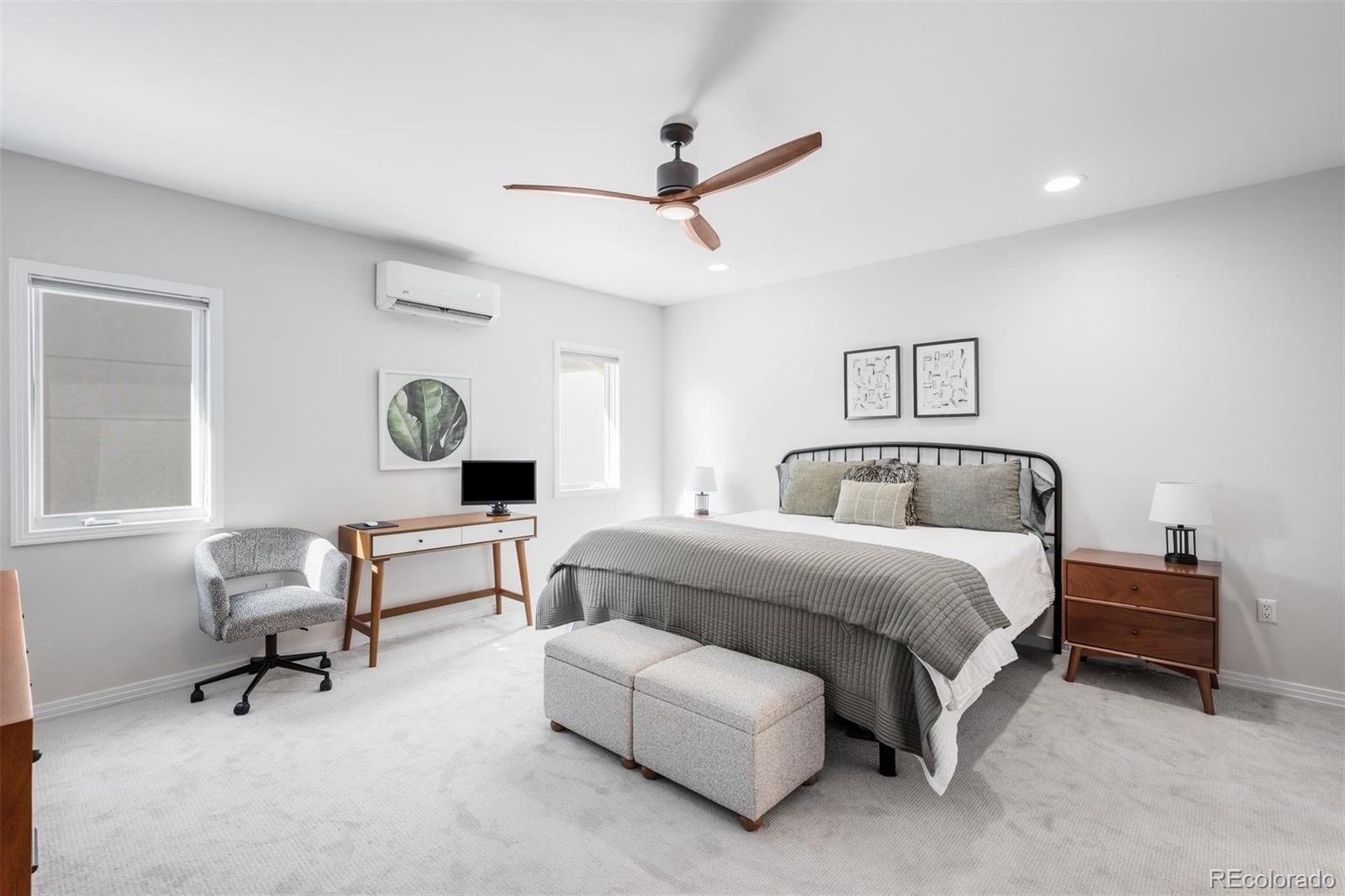 361 Detroit Street Denver, CO 80206 - Photo 27 of 46 a bedroom with bed and a window