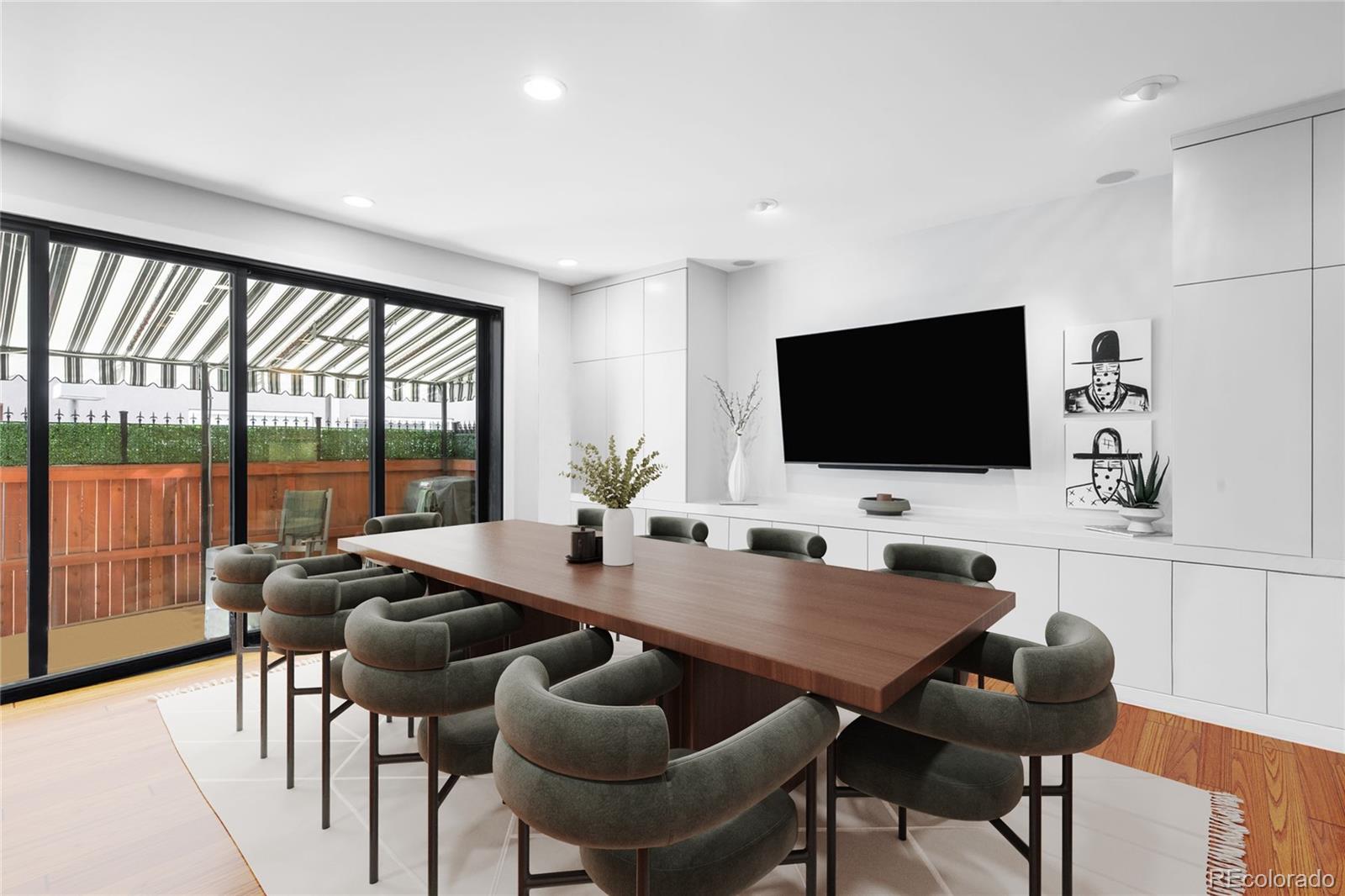 361 Detroit Street Denver, CO 80206 - Photo 5 of 46 a living room with furniture and a flat screen tv