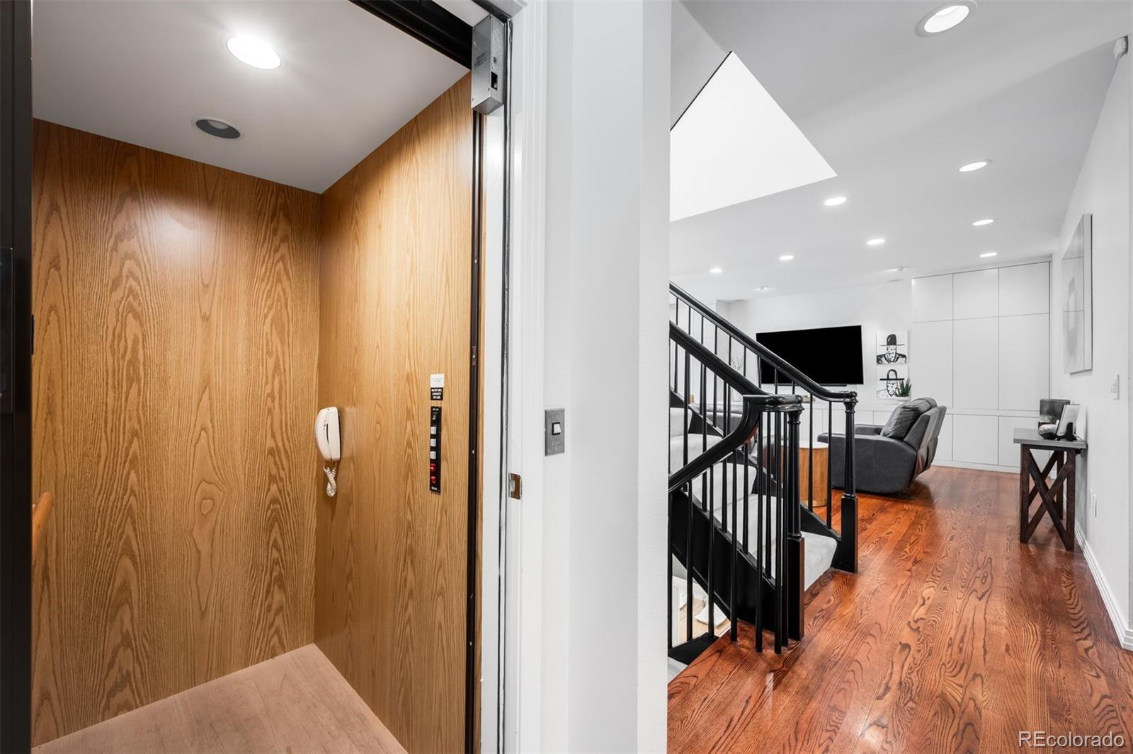 361 Detroit Street Denver, CO 80206 - Photo 8 of 46 a view of a hallway with wooden floor windows