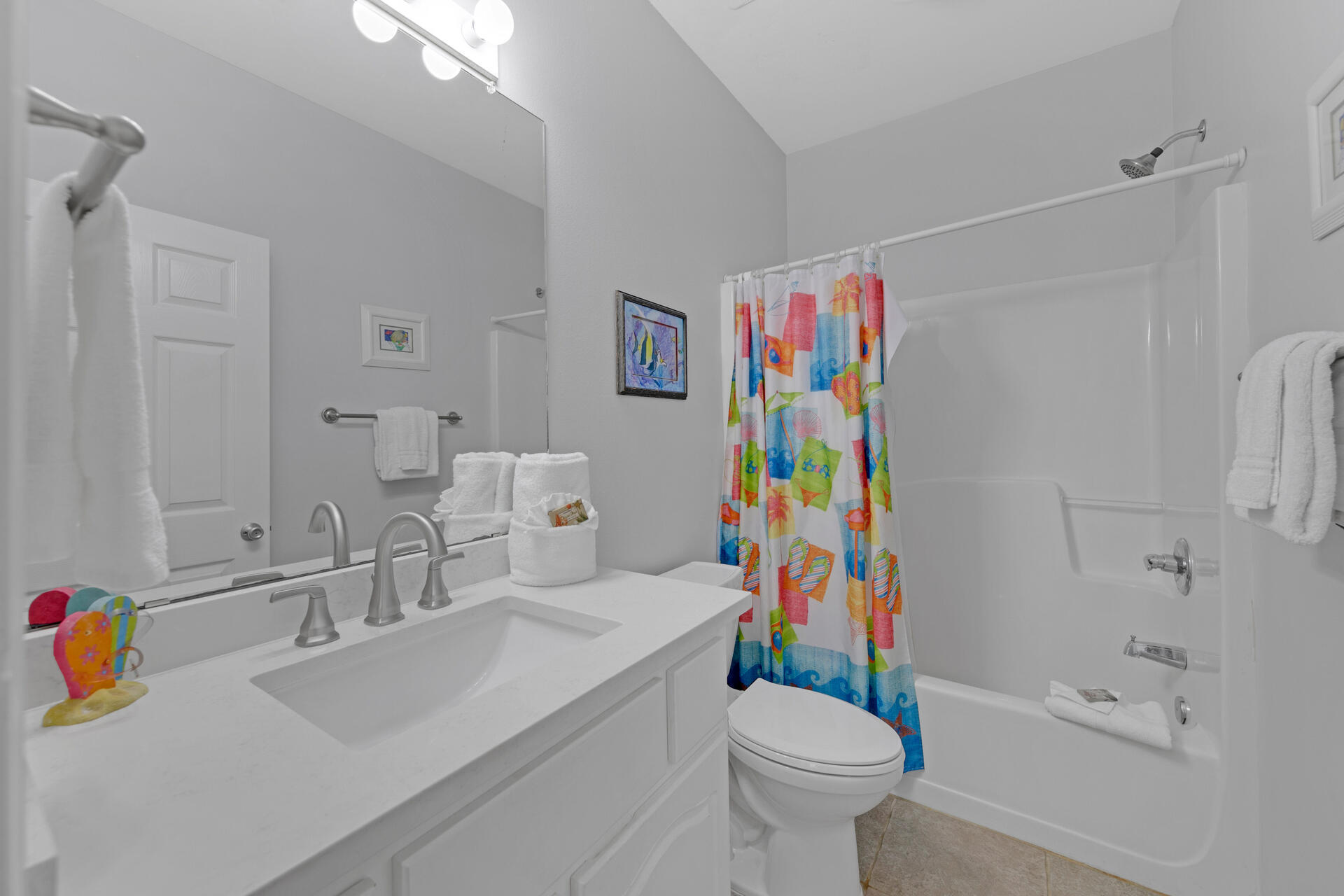97 Hidden Lake Way Santa Rosa Beach, FL 32459 - Photo 30 of 50 a bathroom with a sink a toilet and a shower curtain
