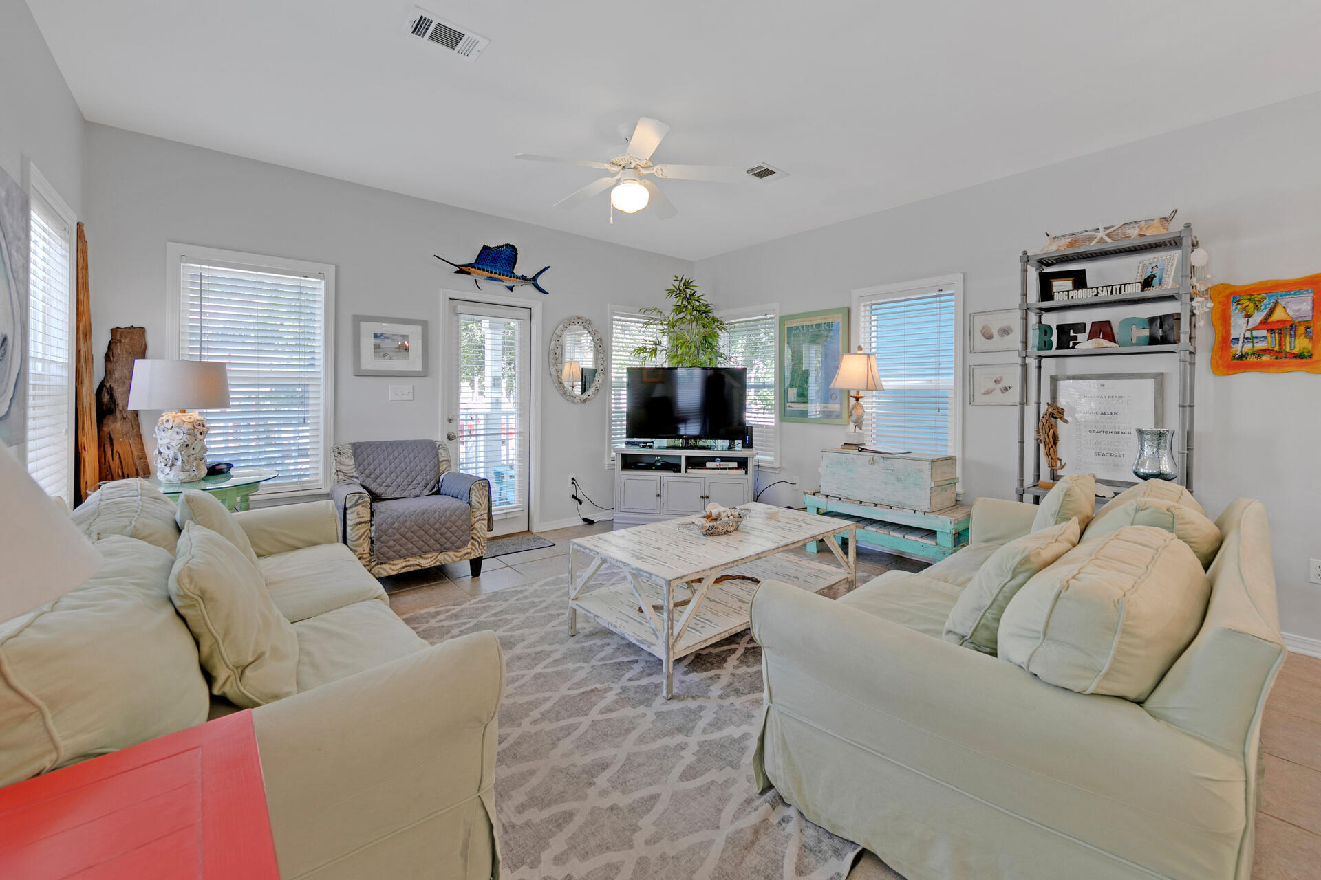 97 Hidden Lake Way Santa Rosa Beach, FL 32459 - Photo 8 of 50 a living room with furniture or couch and a flat screen tv