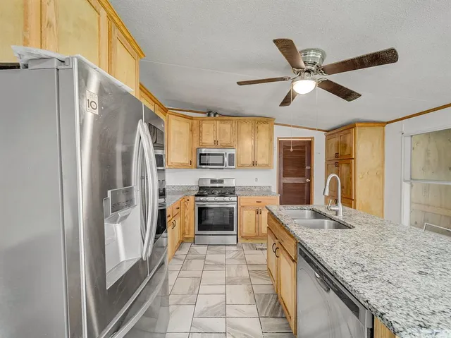 a kitchen with a stove and a microwave