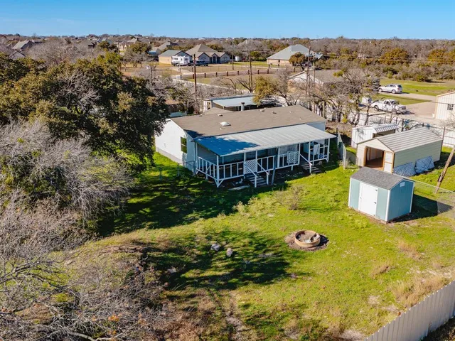 a view of a house with a yard porch and sitting area