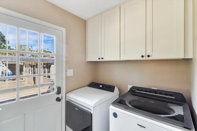 a view of storage and utility room with washer and dryer