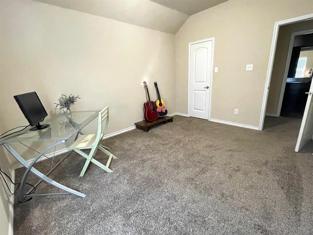 3013 Dominion Street Denton, TX 76209 - Photo 27 of 38 a view of a room with gym equipment