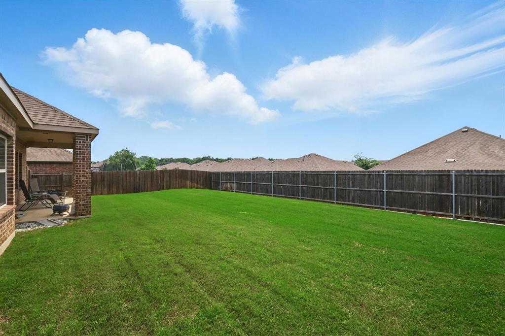 3013 Dominion Street Denton, TX 76209 - Photo 32 of 38 a view of a backyard
