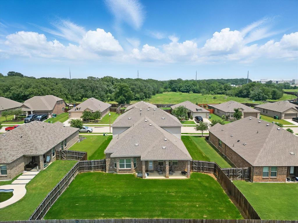 3013 Dominion Street Denton, TX 76209 - Photo 36 of 38 an aerial view of multiple houses with yard
