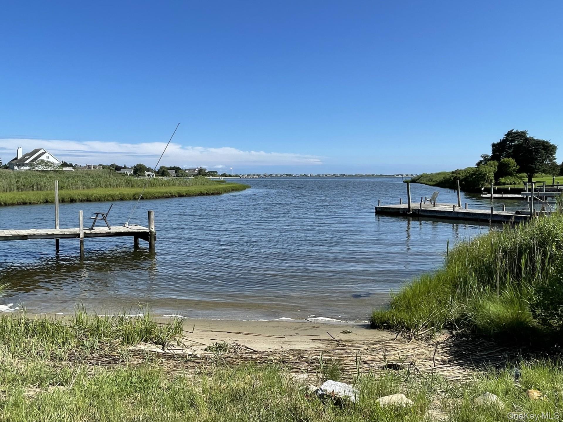 28 Apaucuck Point Road Westhampton, NY 11977 - Photo 3 of 4 a view of a lake with outside seating space