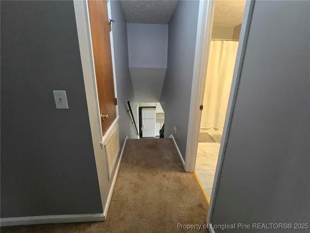 a view of entryway and kitchen