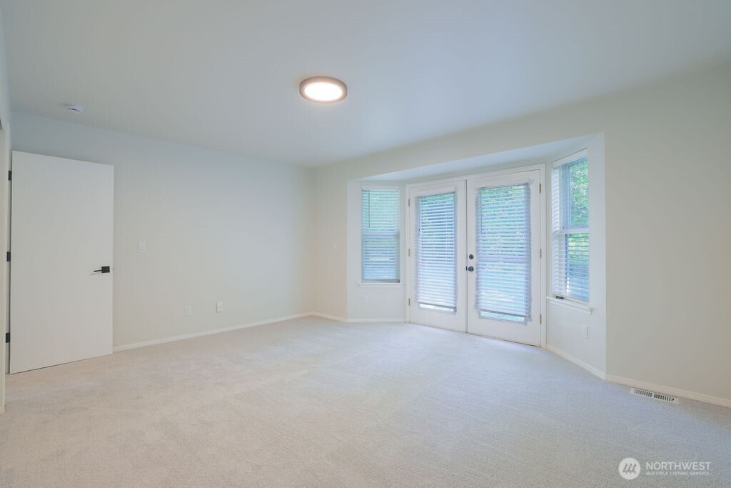 10720 Eustis Hunt Road East Graham, WA 98338 - Photo 15 of 27 a view of an empty room with window