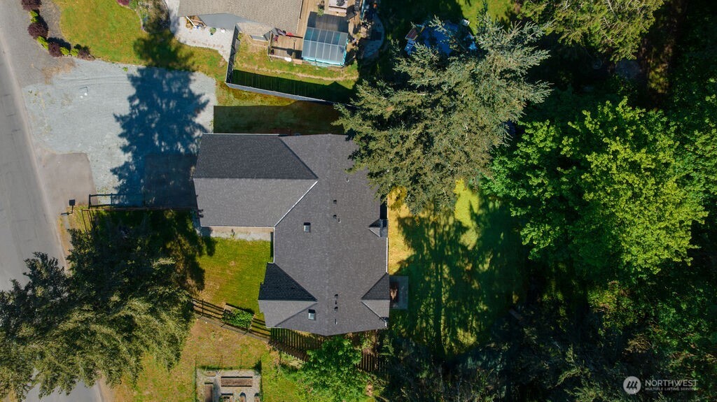 10720 Eustis Hunt Road East Graham, WA 98338 - Photo 25 of 27 an aerial view of a house with swimming pool and garden