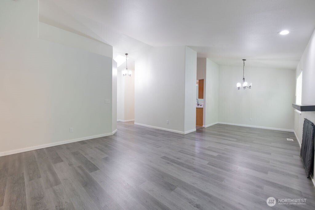 10720 Eustis Hunt Road East Graham, WA 98338 - Photo 5 of 27 a view of empty room with wooden floor