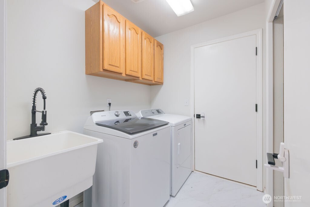 10720 Eustis Hunt Road East Graham, WA 98338 - Photo 7 of 27 a bathroom with a sink and a mirror