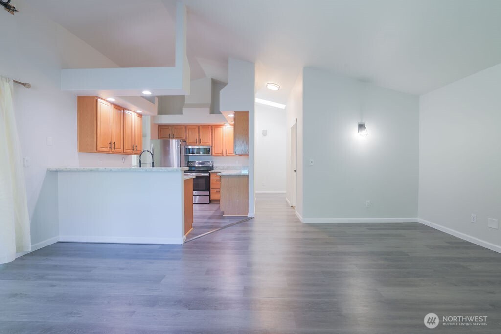 10720 Eustis Hunt Road East Graham, WA 98338 - Photo 10 of 27 a view of kitchen with wooden floor