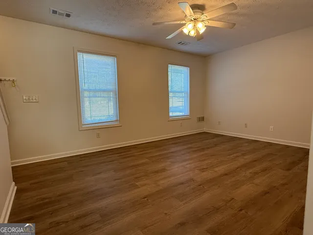 a view of a hallway view with staircase
