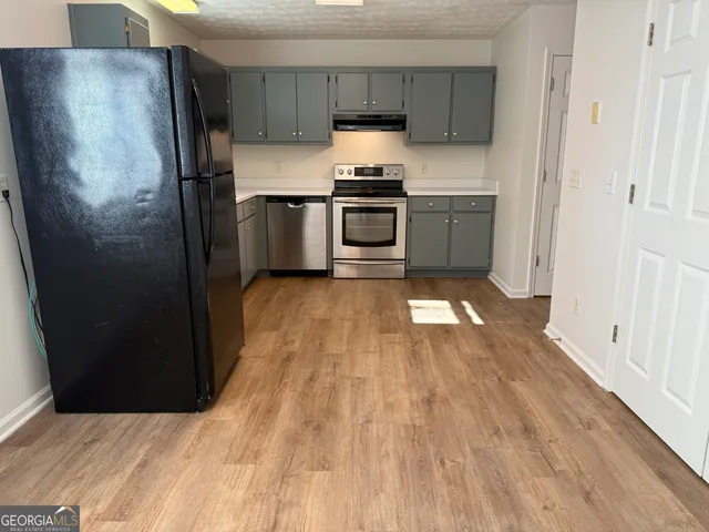 a bathroom with a sink toilet and a mirror