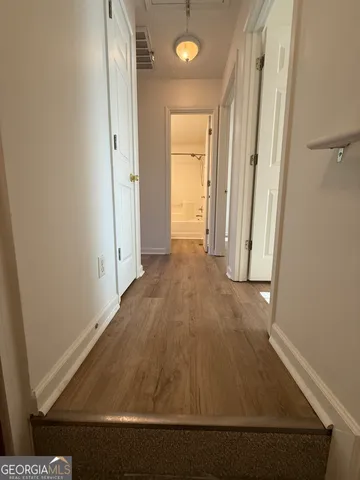 a view of a room with racks on the wall