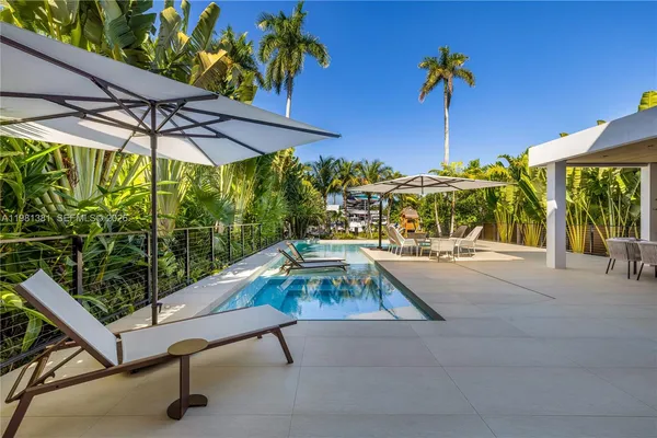 a view of swimming pool with a patio