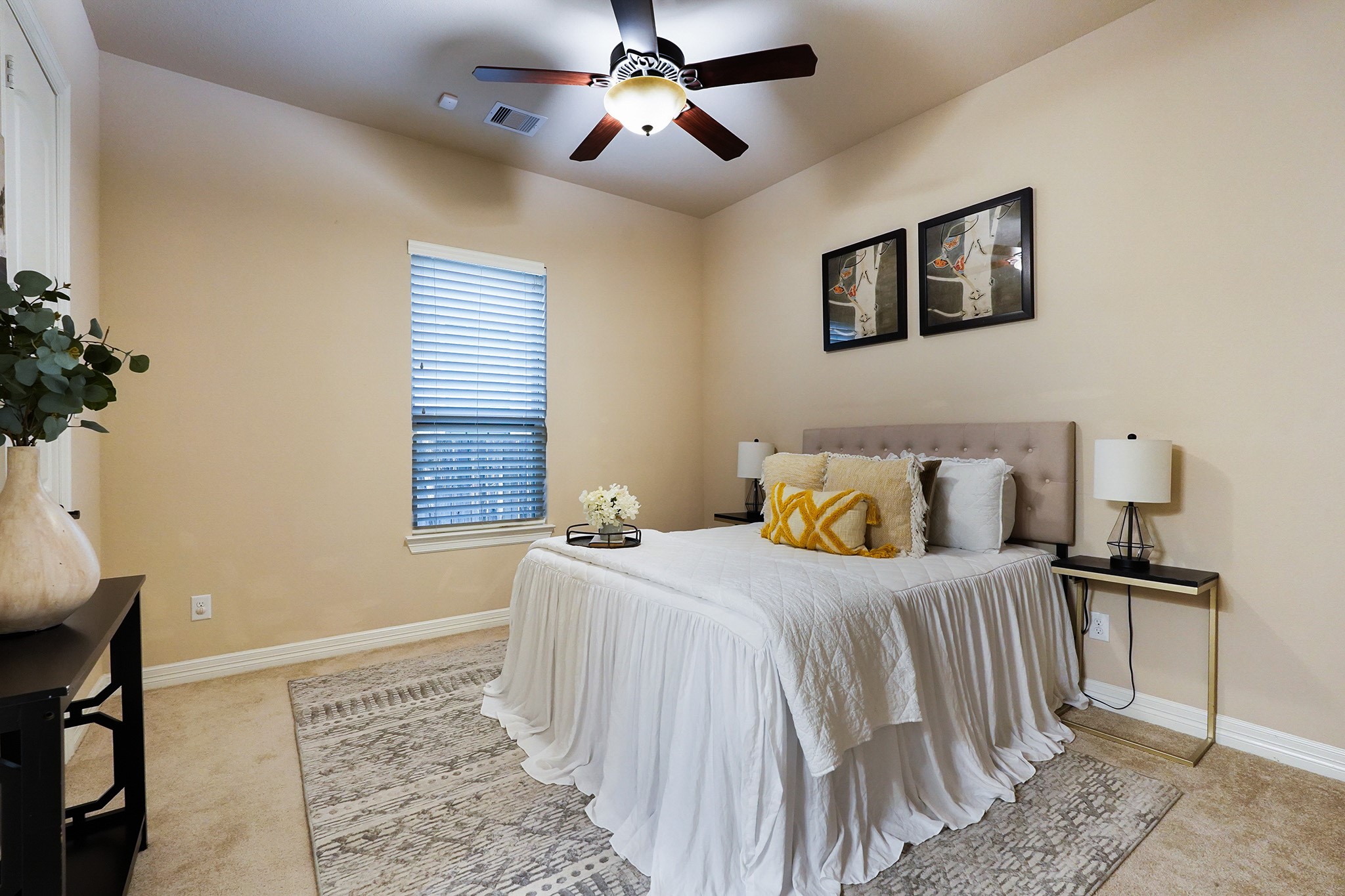 3102 Barrons Way Sugar Land, TX 77479 - Photo 17 of 42 FIRST Flr-2nd bedroom down: This cozy bedroom features neutral walls, a ceiling fan, and ample natural light from a single window.