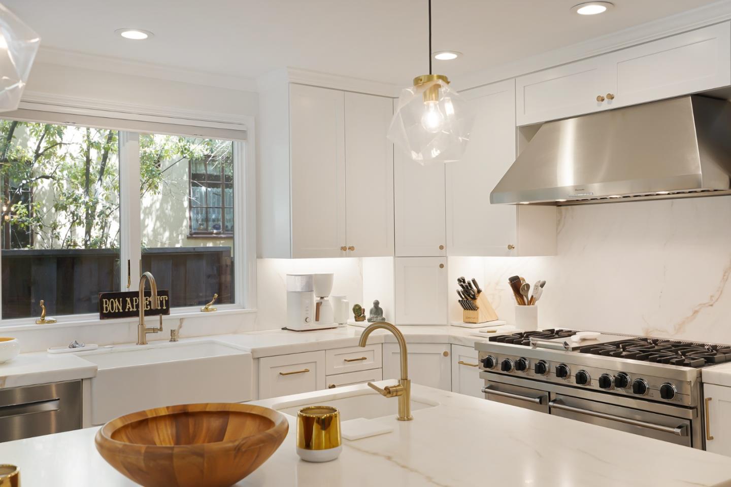 1467 Cabrillo Avenue Burlingame, CA 94010 - Photo 17 of 57 a kitchen with stove a sink and a refrigerator
