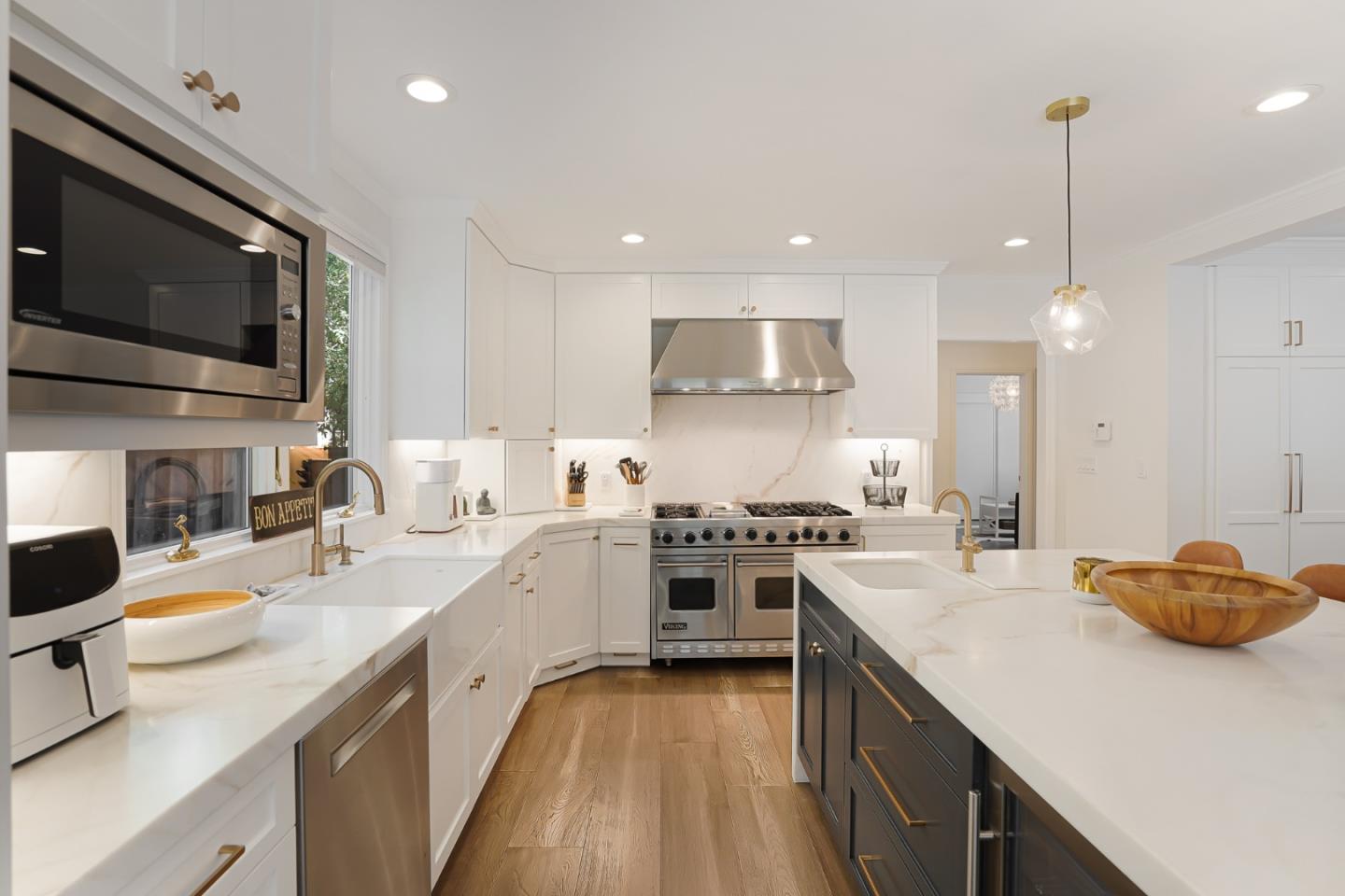 1467 Cabrillo Avenue Burlingame, CA 94010 - Photo 19 of 57 a kitchen with a sink stove and wooden floor
