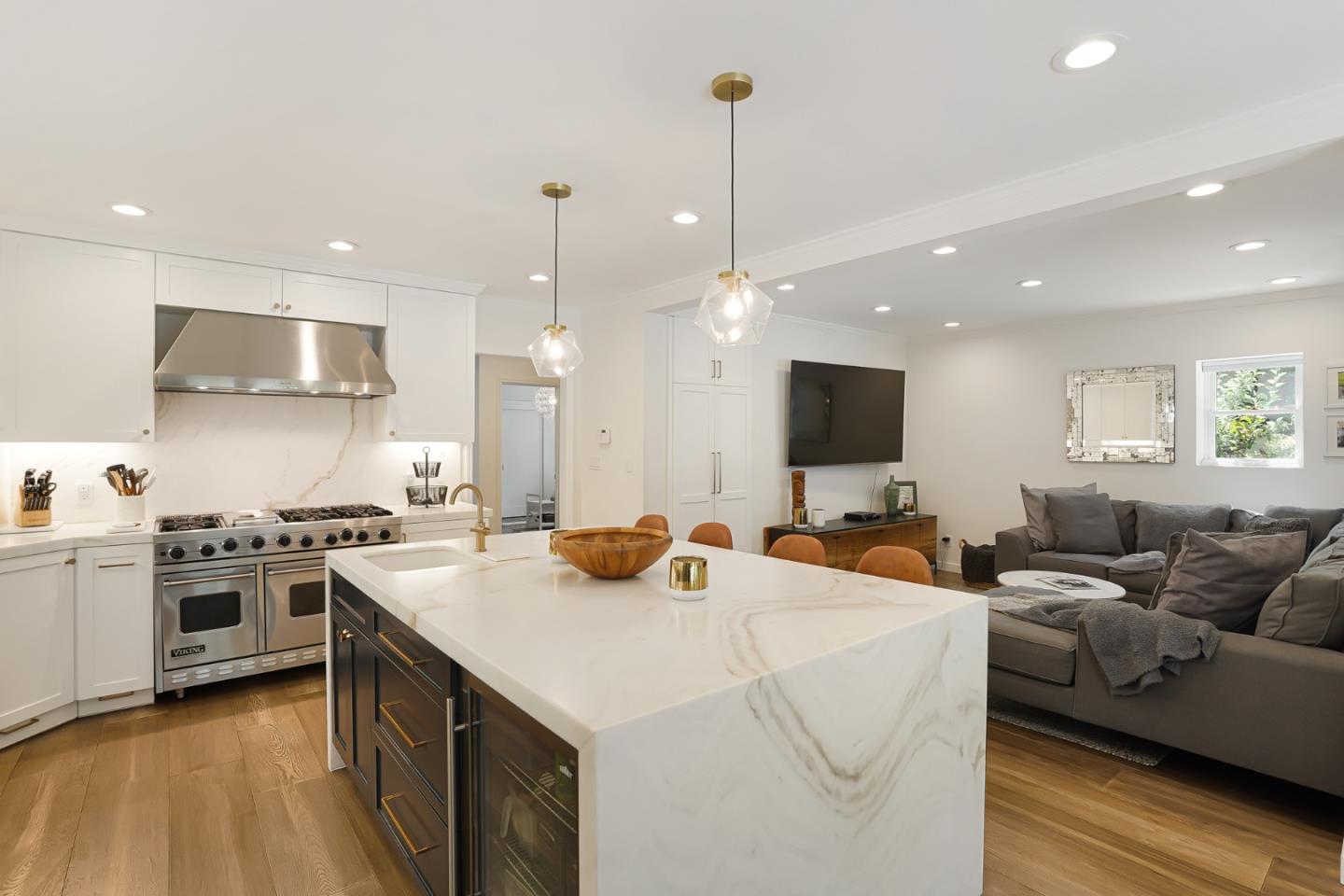 1467 Cabrillo Avenue Burlingame, CA 94010 - Photo 20 of 57 a view of a kitchen with kitchen island a stove a sink a center island and a living room